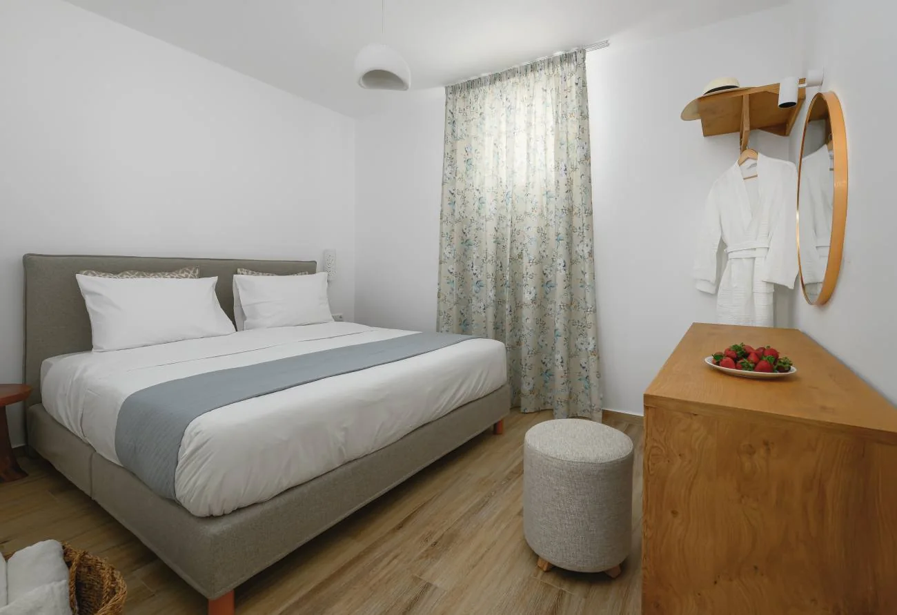 Light-filled bedroom with a double bed