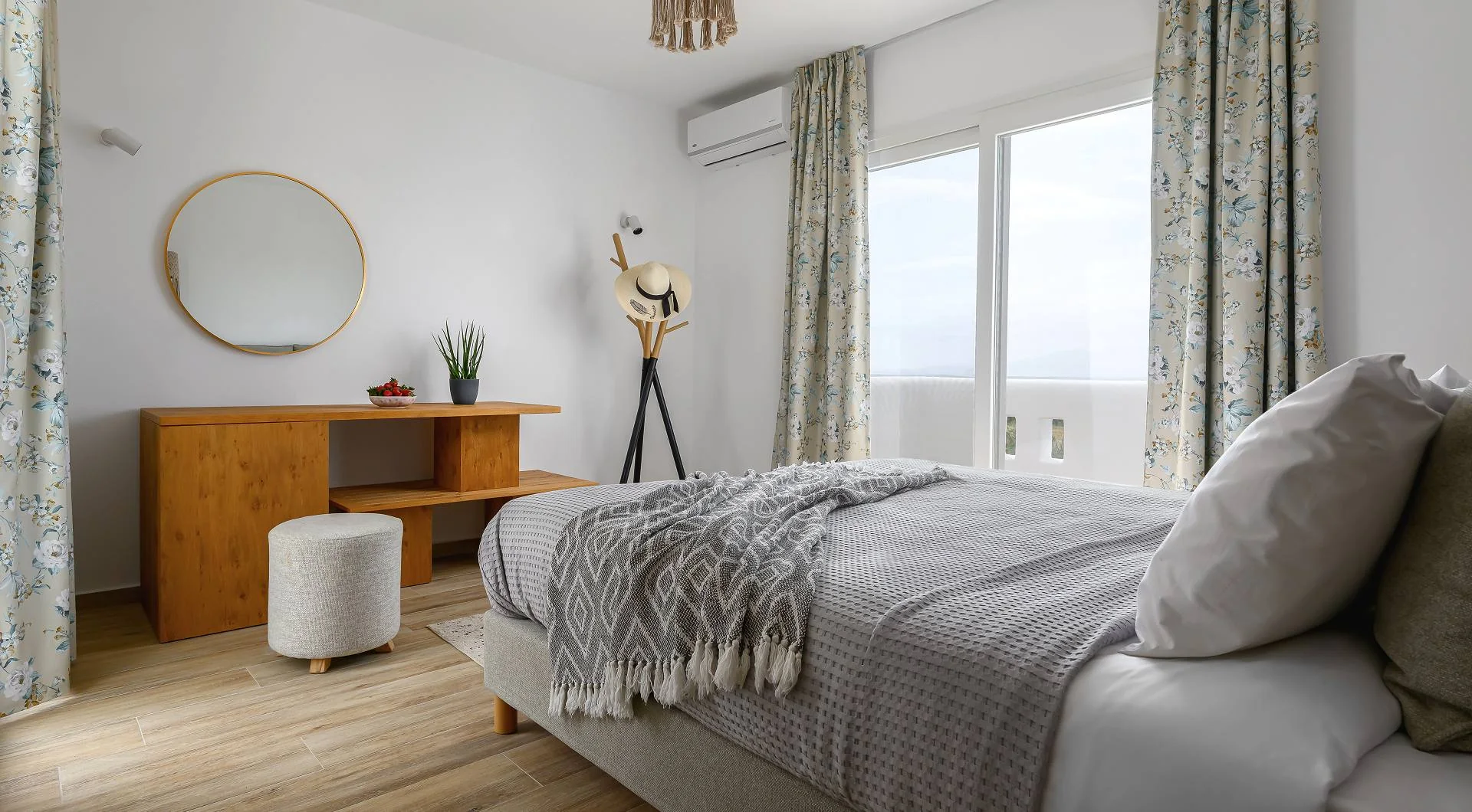 Bright bedroom with natural textures at Naxian Garden Villas